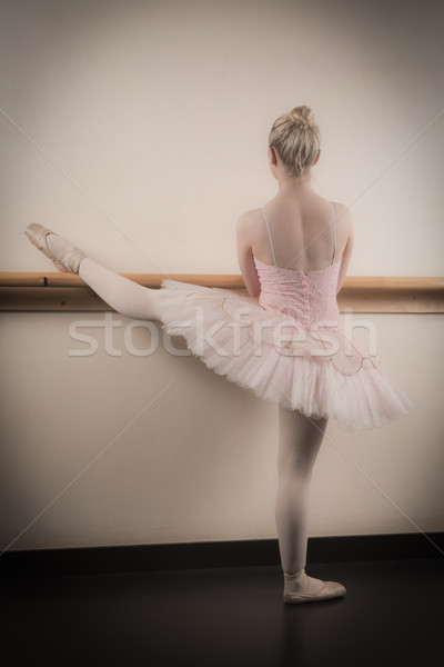 Beautiful ballerina warming up with the barre Stock photo © wavebreak_media