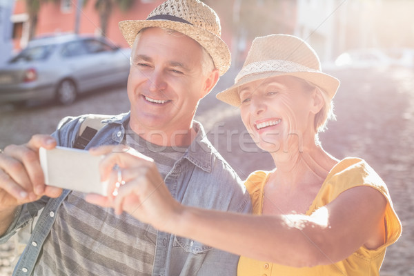 Happy mature couple taking a selfie together in the city Stock photo © wavebreak_media