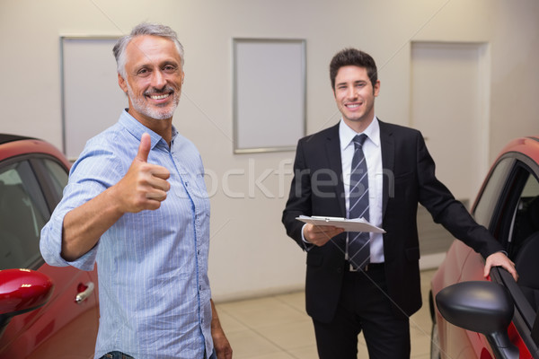 Stock photo: Smiling customer giving thumbs up