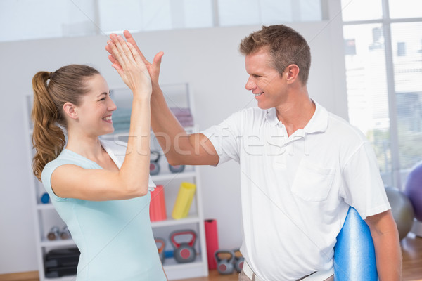 Stock photo: Woman celebrating with her trainer