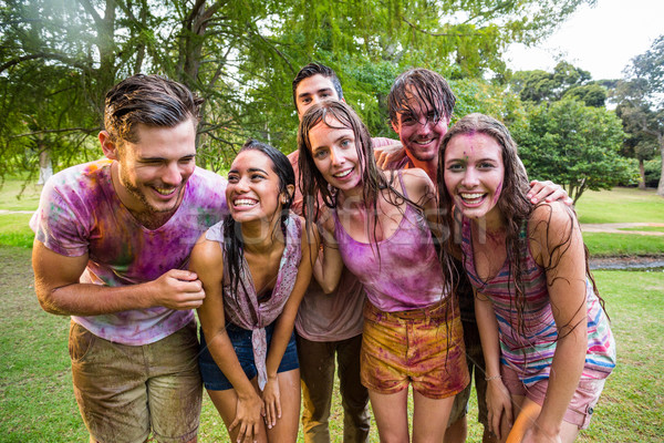 Happy friends covered in powder paint Stock photo © wavebreak_media
