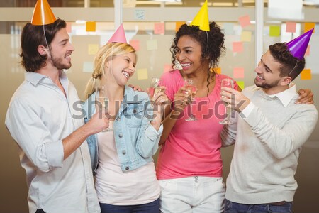 Stock photo: Casual business team celebrating a birthday