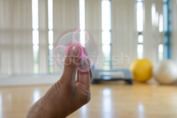 Girl playing with fidget spinner  Stock photo © wavebreak_media