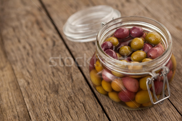 Foto stock: Azeitonas · Óleo · vidro · jarra · mesa · de · madeira