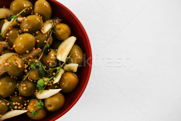 Stock photo: Marinated olives with garlic and herbs in bowl