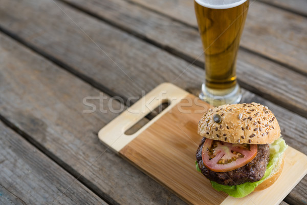High angle view of hamburger on cutting board by beer Stock photo © wavebreak_media