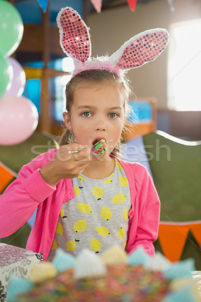 Birthday girl eating a cake Stock photo © wavebreak_media