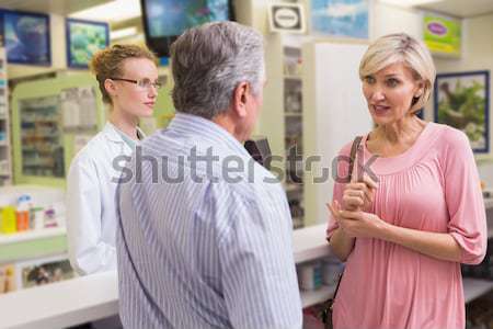 Stock photo: Smiling daughter in fairy costume putting makeup on her fathers face