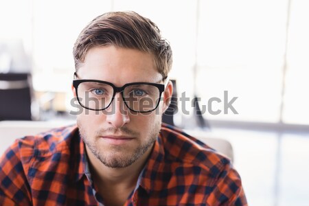 Troubled casual businessman leaning against window Stock photo © wavebreak_media