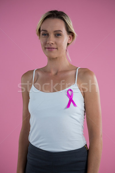 Portrait of smiling with Breast Cancer Awareness ribbon Stock photo © wavebreak_media