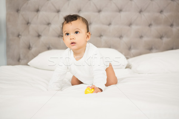 Cute bebé jugando pelota cama casa Foto stock © wavebreak_media