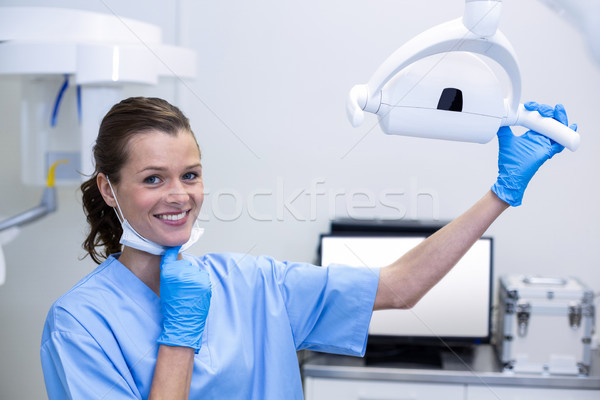 Portrait of dental assistant adjusting light  Stock photo © wavebreak_media