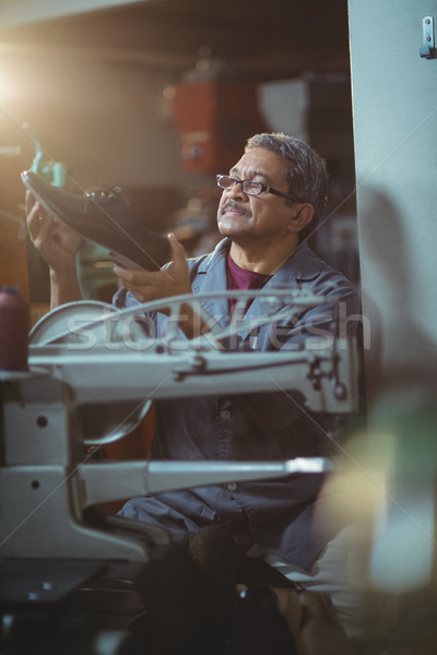 Shoemaker examining a shoe Stock photo © wavebreak_media