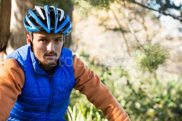 Portrait of male mountain biker in the forest Stock photo © wavebreak_media