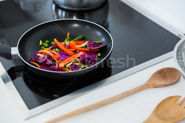 Food on a induction cooktop in kitchen Stock photo © wavebreak_media