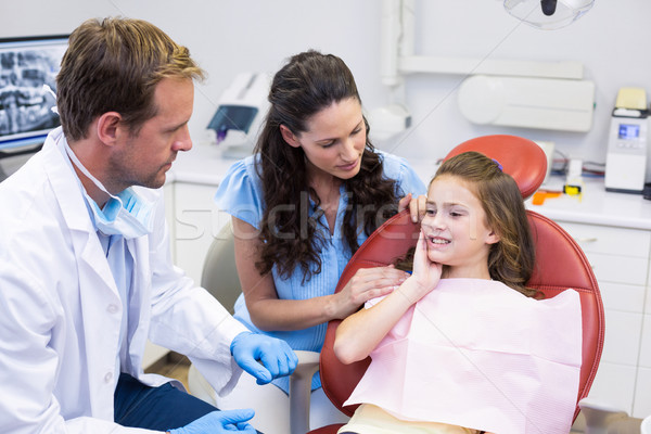 Young patient showing teeth to dentist Stock photo © wavebreak_media