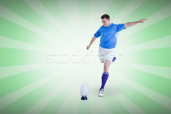 Composite image of rugby player doing a drop kick Stock photo © wavebreak_media