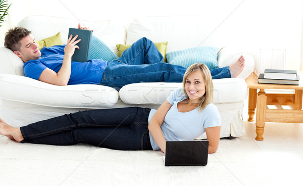 Happy couple having fun together in the living-room Stock photo © wavebreak_media