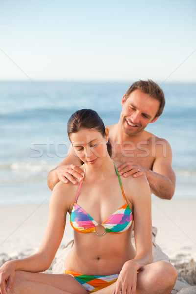 Attentive man applying sun cream on his girlfriend's back Stock photo © wavebreak_media