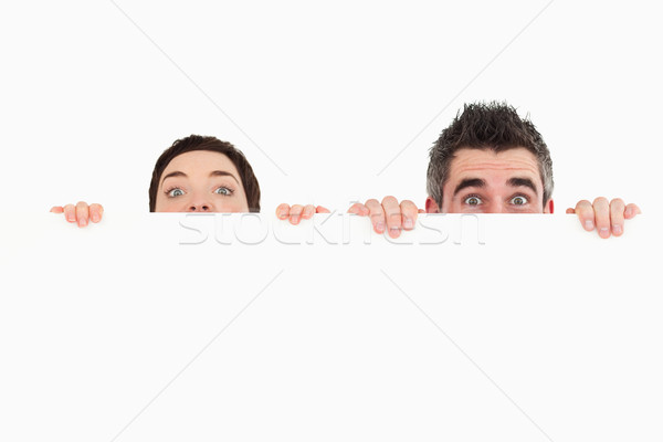 Man vrouw verbergen achter exemplaar ruimte blanke man Stockfoto © wavebreak_media