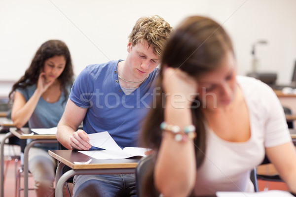 Good looking students doing an assignment in a classroom Stock photo © wavebreak_media