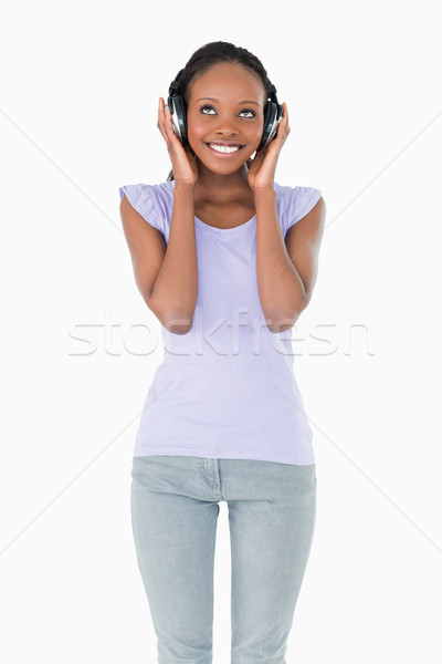Heureux jeune femme musique blanche [[stock_photo]] © wavebreak_media