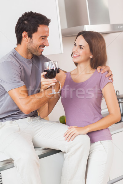 Couple toasting with arms crossed with a glass of wine Stock photo © wavebreak_media