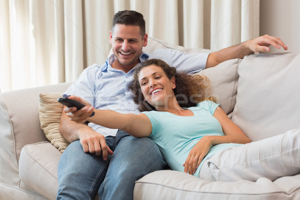 Casal assistindo tv sala de estar feliz casa Foto stock © wavebreak_media