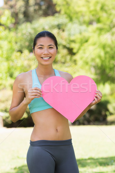 улыбающаяся женщина формы сердца совета парка портрет Сток-фото © wavebreak_media