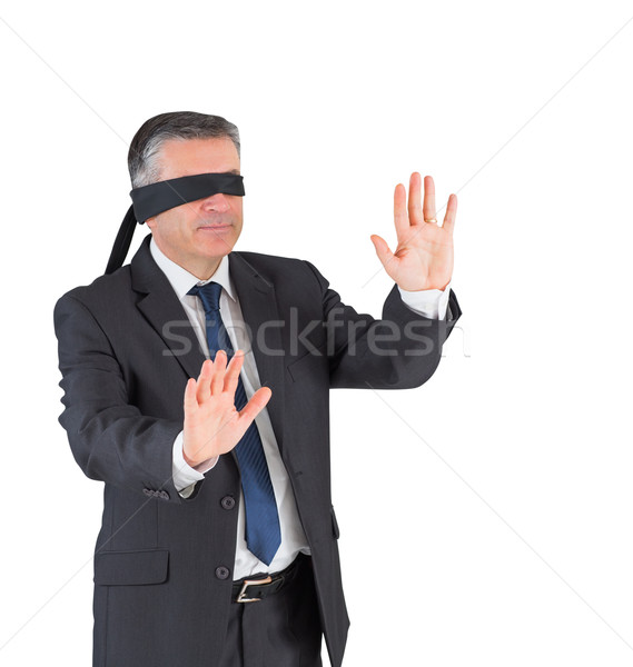 Mature businessman walking with blindfold Stock photo © wavebreak_media