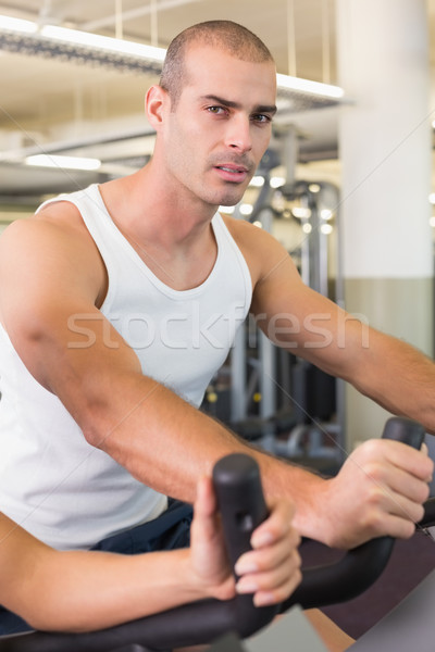 Man working out on exercise bike at gym Stock photo © wavebreak_media