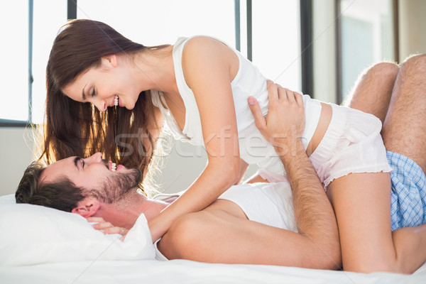 Young couple having fun in bed Stock photo © wavebreak_media