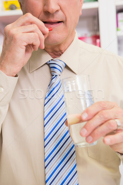 Stock photo: Senior patient taking a pill 