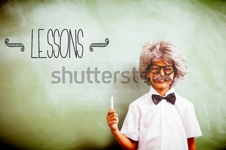 Stock photo: Boy dressed as senior teacher in front of blackboard