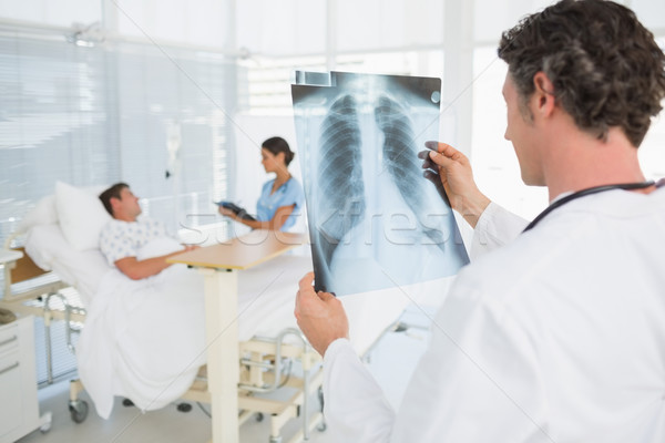 Doctor checking patients xray Stock photo © wavebreak_media
