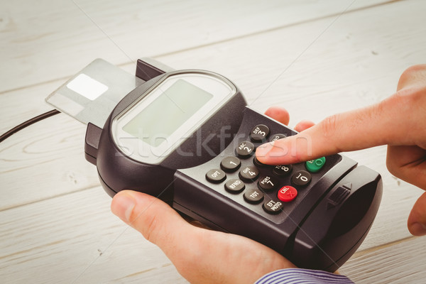 Man entering his pin on terminal Stock photo © wavebreak_media