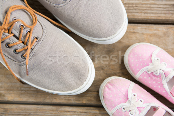 Overhead view of gray and pink shoes on table Stock photo © wavebreak_media