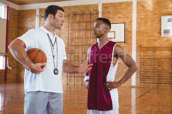 Coach guiding basketball player Stock photo © wavebreak_media