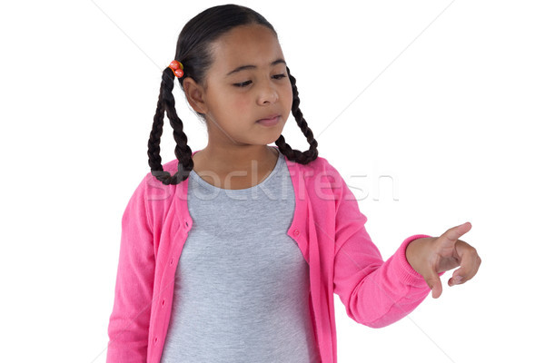 Girl pretending to touch an invisible screen Stock photo © wavebreak_media
