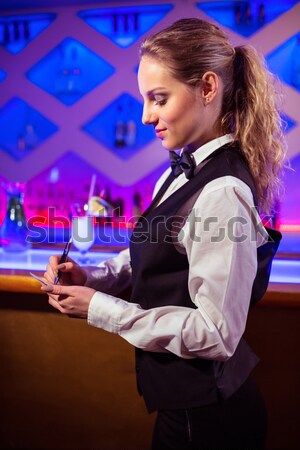 Woman sipping on a drink Stock photo © wavebreak_media