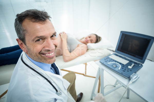 Pregnant woman receiving ultrasound treatment Stock photo © wavebreak_media