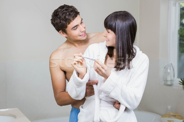 Happy couple checking results of pregnancy test Stock photo © wavebreak_media
