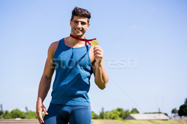 Athlète médaille d'or heureux stade homme [[stock_photo]] © wavebreak_media