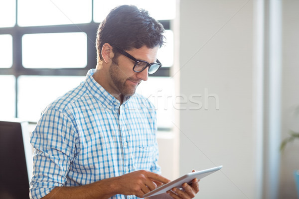 Male business executive using digital tablet Stock photo © wavebreak_media