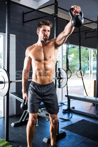 Male athlete exercising with kettlebells  Stock photo © wavebreak_media