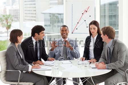 Stock photo: Serious co-workers studying a new business plan
