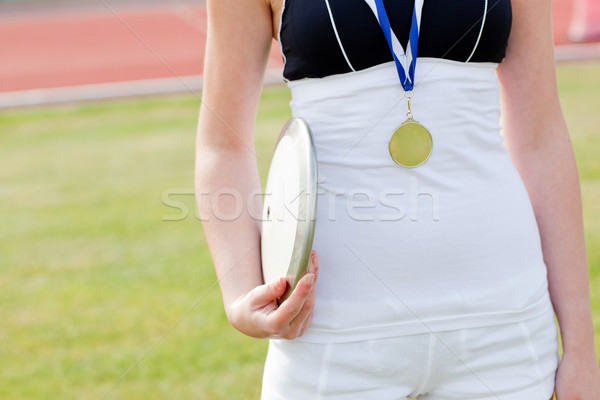 Vrouwelijke atleet gouden medaille schijf Stockfoto © wavebreak_media