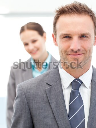 Two smiling business people posing in a row at work Stock photo © wavebreak_media