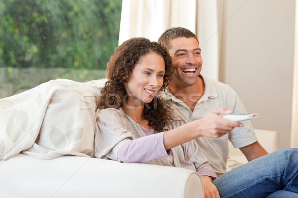 Couple watching tv in their living room at home Stock photo © wavebreak_media