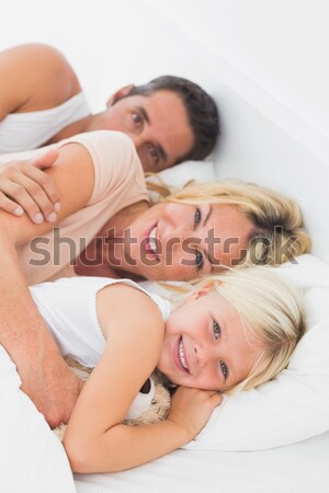 Portrait Of A Cute Couple Sleeping In Their Bedroom Stock